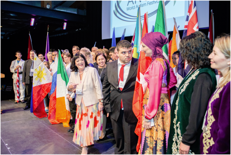 on stage with flags - for elite sponsor page